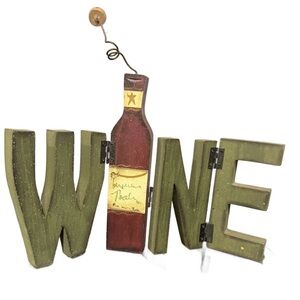 Decorative 'WINE' Tabletop Sign with Olive Green Letters and Red Bottle Accent